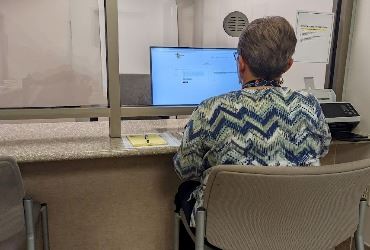 Building permit kiosk in use on the second floor of City Hall