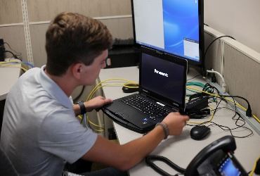 Cocoa High School student interning in the IT department as part of the Cocoa Works program