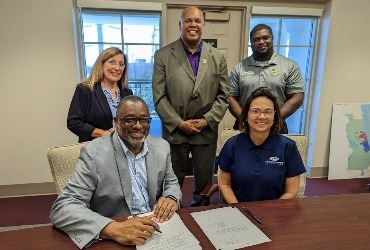 Members of Council, the City Manager and Executive Director of CHI executing the agreement 