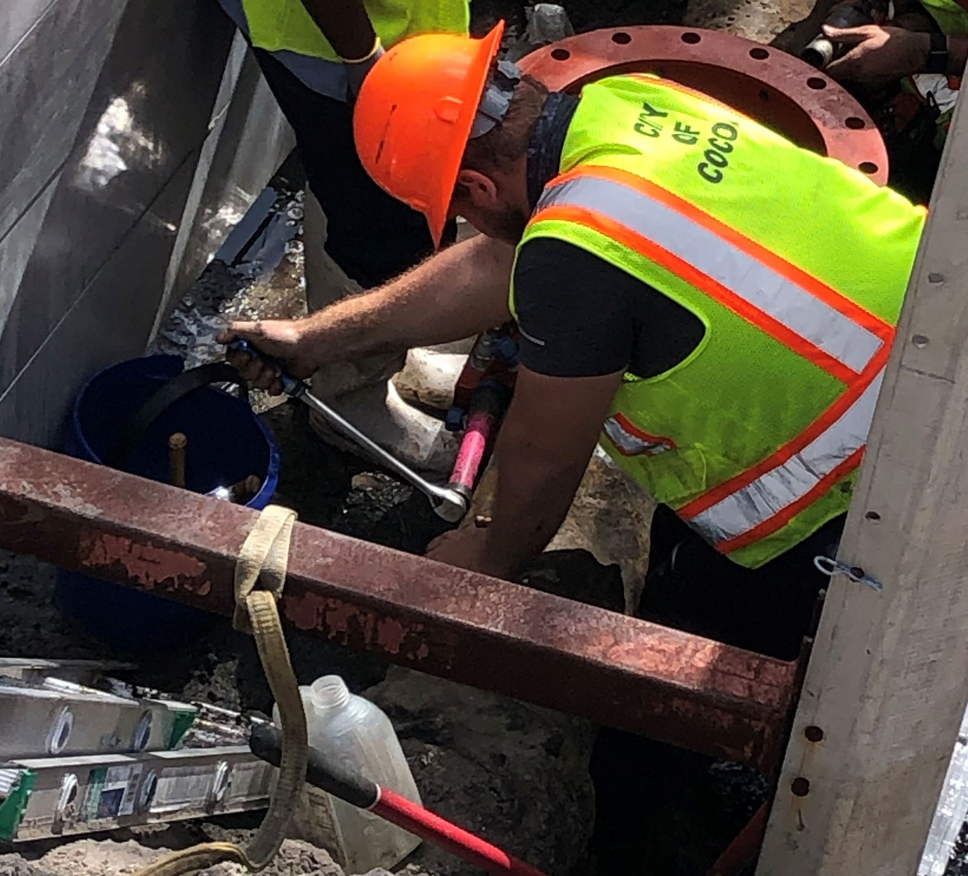 Cocoa Utilities' WFO employee working on 10 inch force main valve